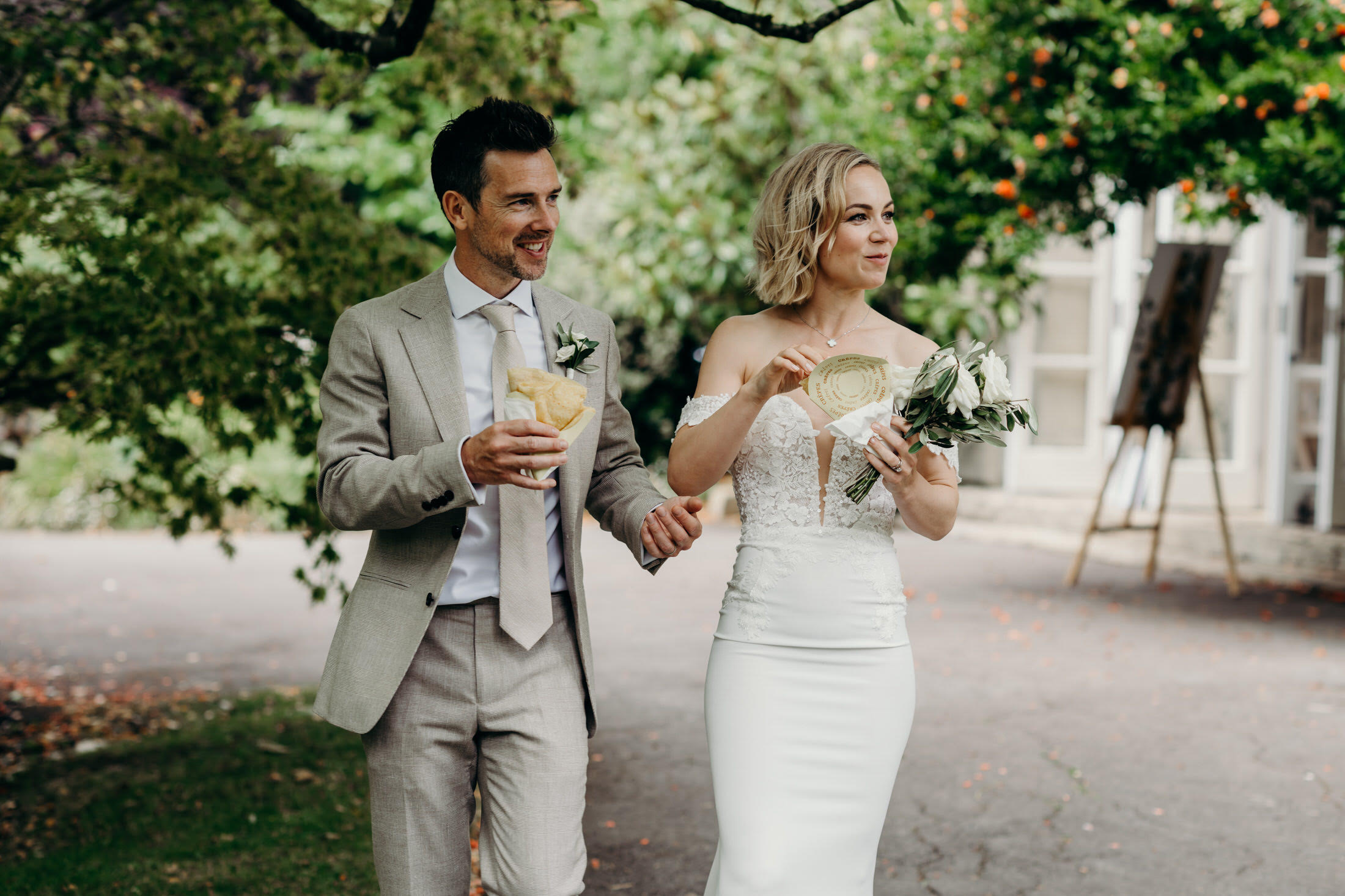 Bride and groom enjoying Eden Crepes at their wedding reception