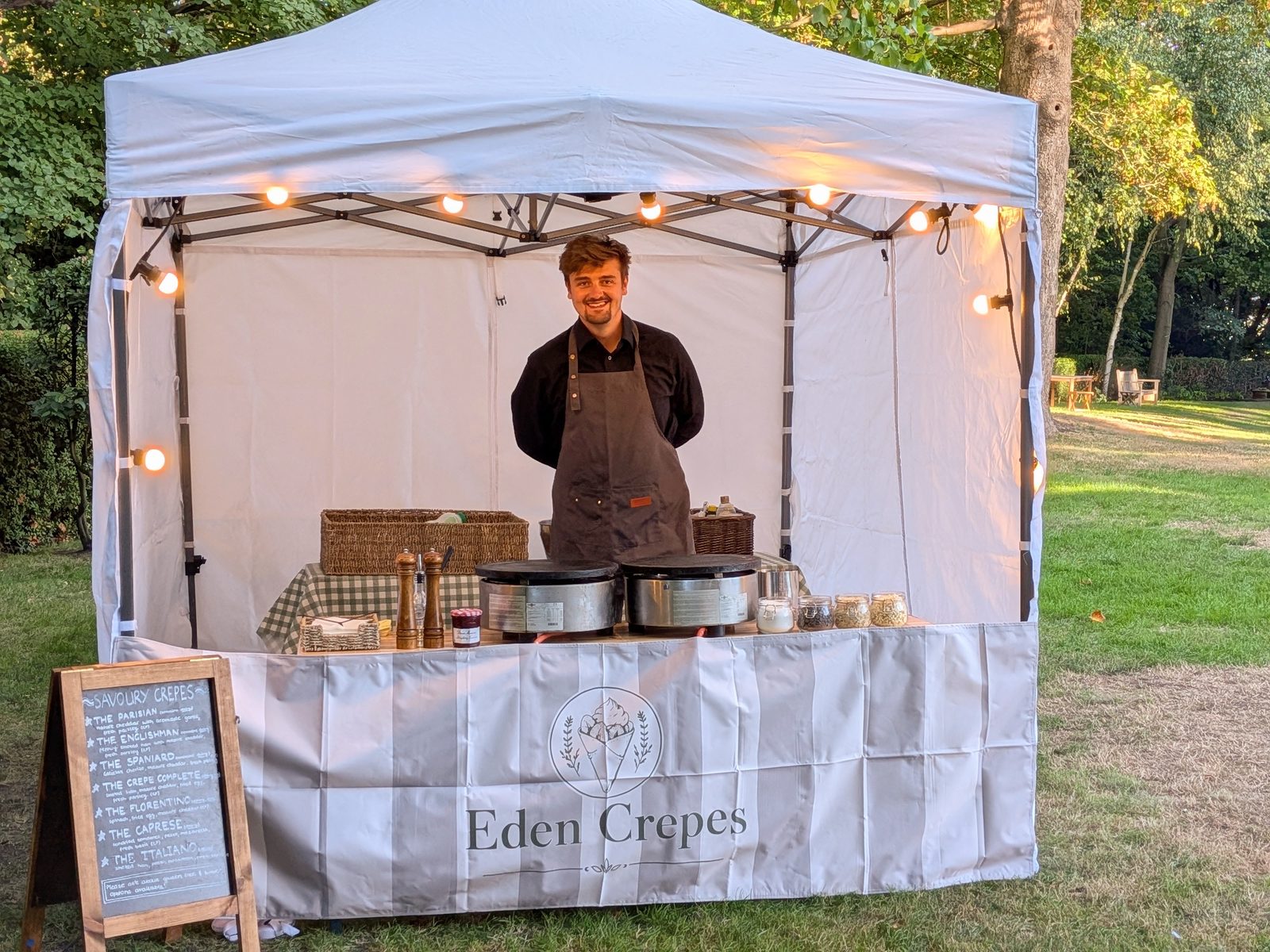 Eden Crepes branded gazebo crepe stall with festoon lighting